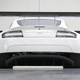 Illustration for article titled An Aston Martin With A Dinner Table Hanging Under Its Rear End Means Business